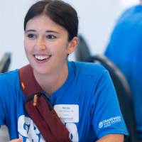 Woman smiling and looking off camera